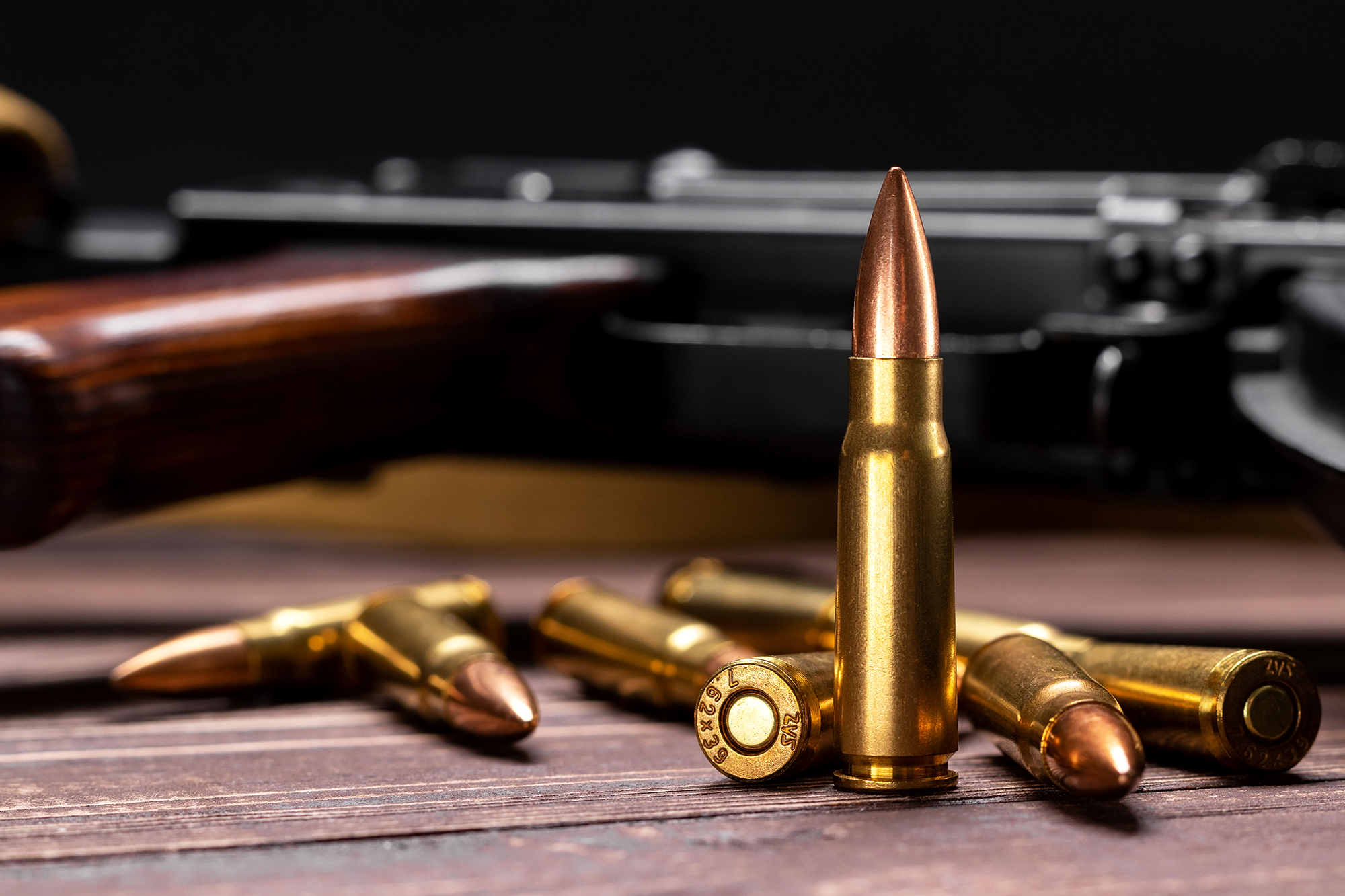 Rifle Ammunition Display with Firearm Background