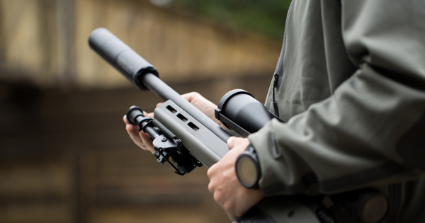 Close-up of a person holding a rifle, illustrating a blog post about Missouri gun legislation and public safety concerns.